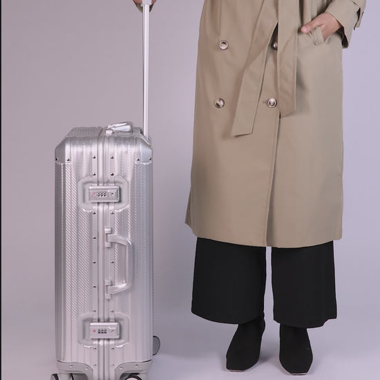 Women Holding CHAVELLE Luggage