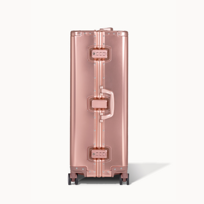 CHAVELLE aluminium suitcase rose gold close-up of TSA-approved lock and side handle