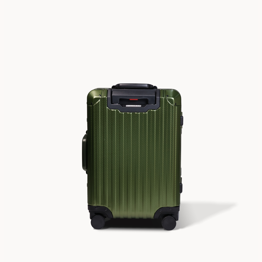 Green suitcase with black handle and wheels on a white background