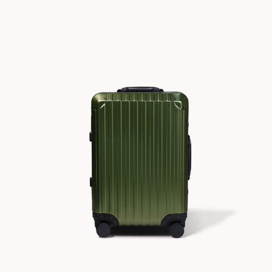 Green suitcase with black wheels on a white background