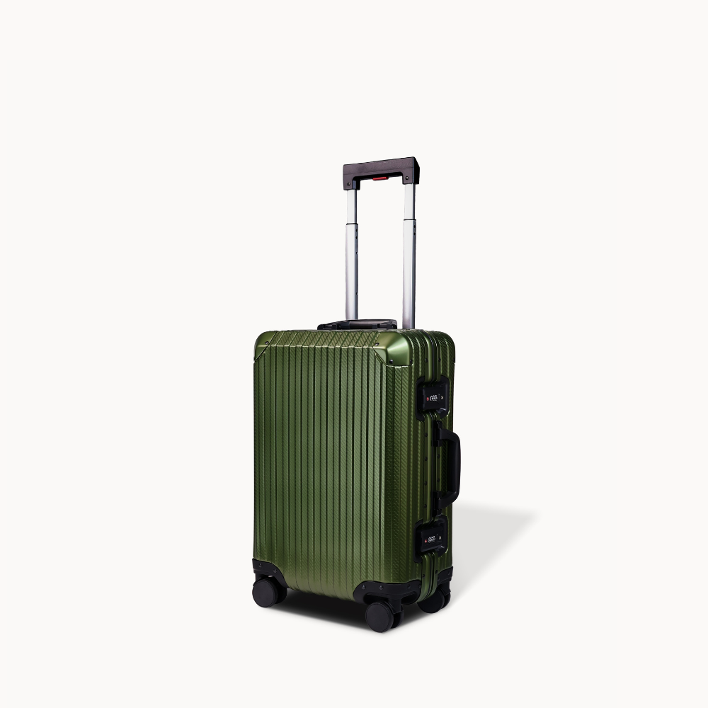 Green suitcase with a black handle on a white background