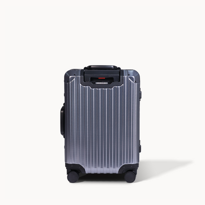 Silver suitcase with black accents on a white background