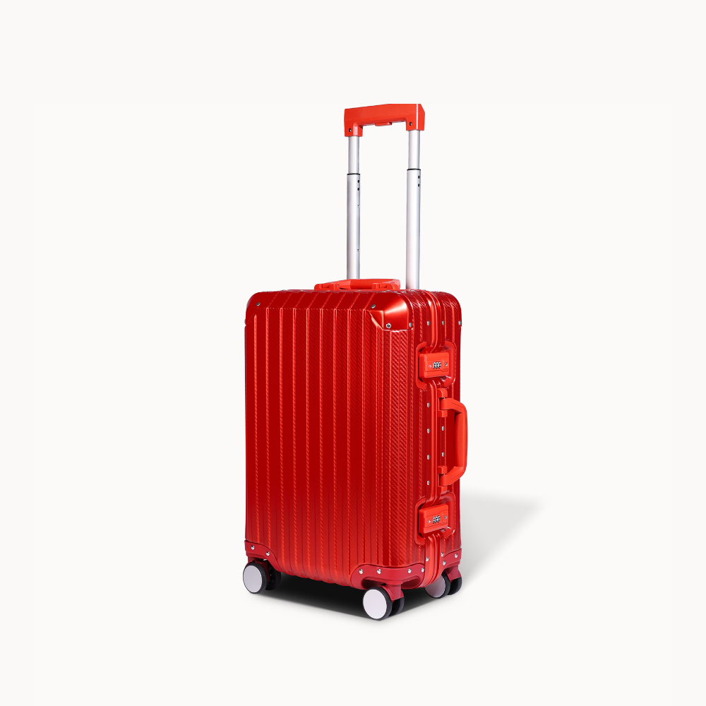 Red suitcase with a visible brand logo on a white background