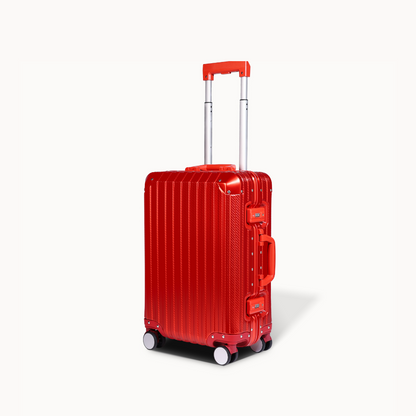 Red suitcase with a visible brand logo on a white background