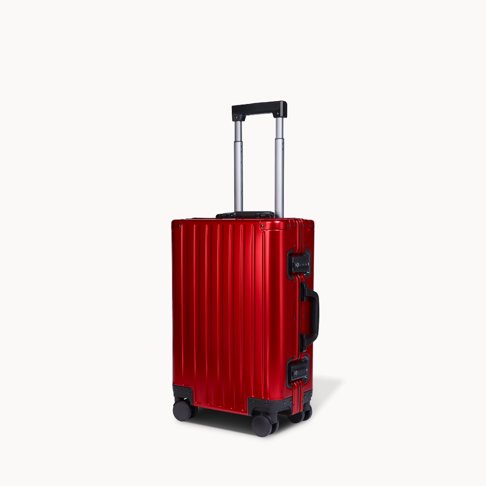 CHAVELLE aluminium suitcase cherry red angled view showing reinforced corners and sleek finish 