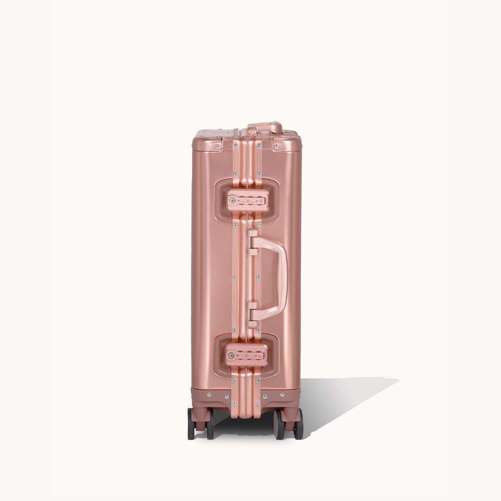 CHAVELLE aluminium suitcase rose gold close-up of TSA-approved lock and side handle