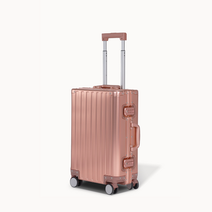 CHAVELLE aluminium suitcase rose gold angled view showing reinforced corners and sleek finish