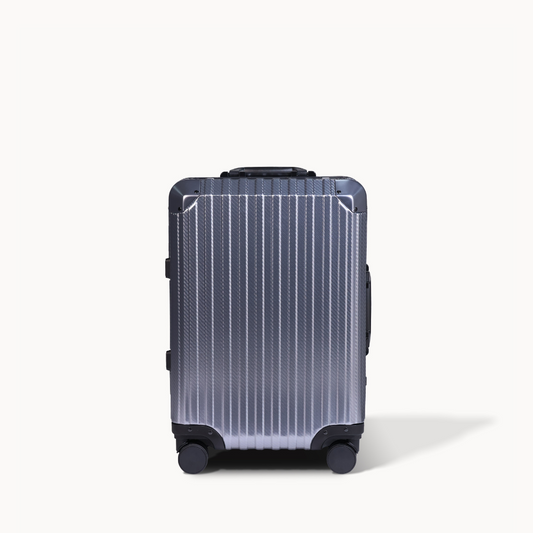 Black suitcase with a textured surface on a white background